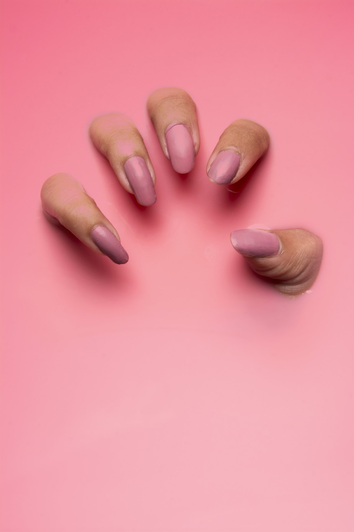 Nude almond-shaped gel manicure