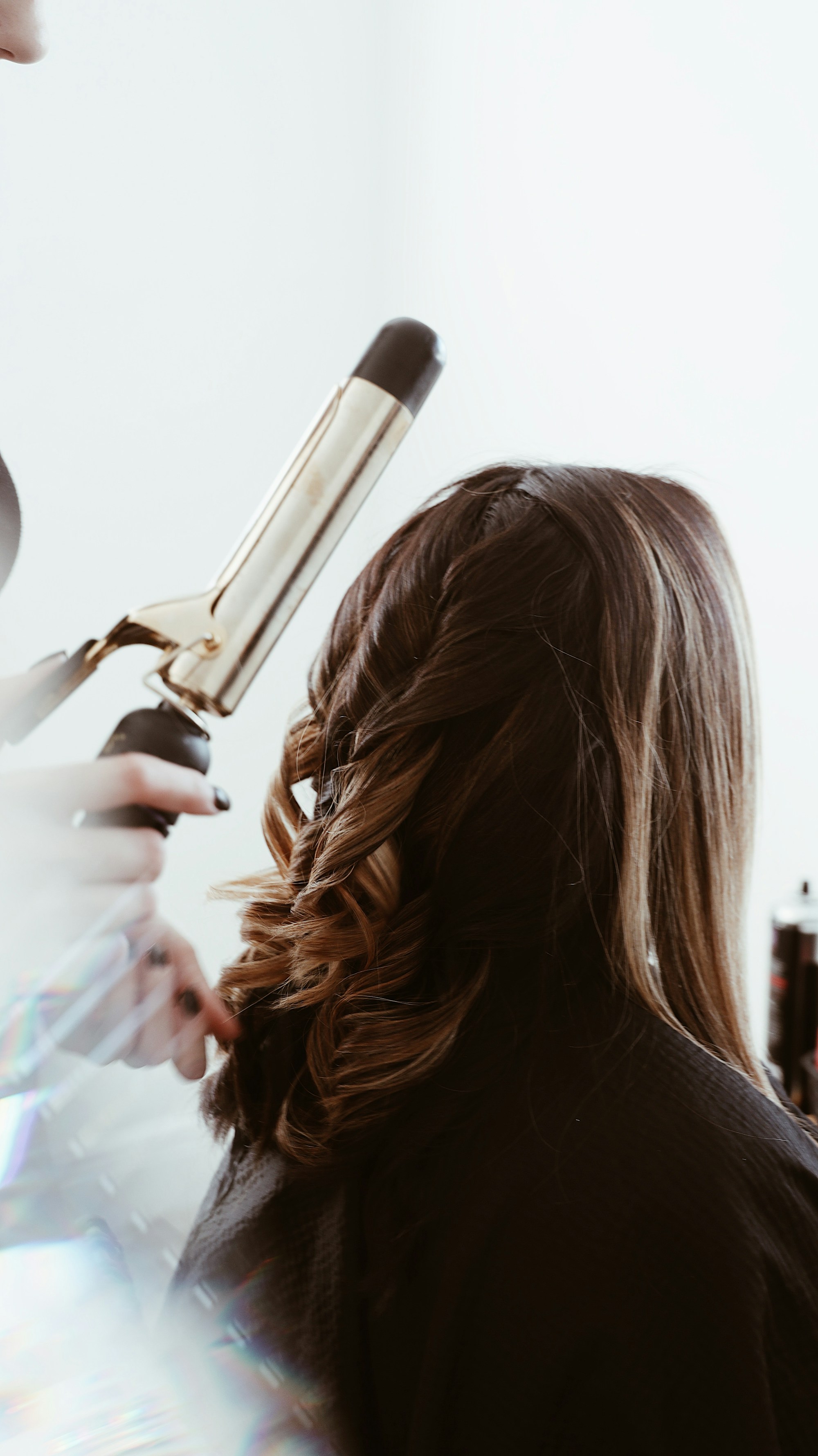 Hands working precise makeup application